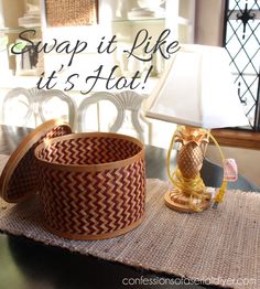 a table with a lamp, basket and pineapple figurine on it that says scrap it like it's hot