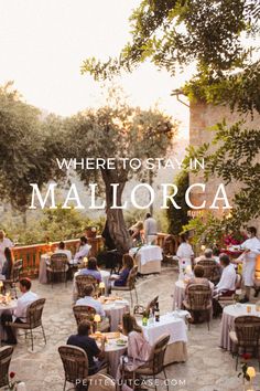 there is an outdoor dining area with people sitting at tables and eating food on the table