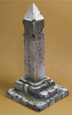 a stone obelisk with writing on it