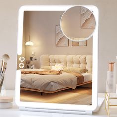 an image of a bedroom with a mirror on the wall and makeup brushes in front of it