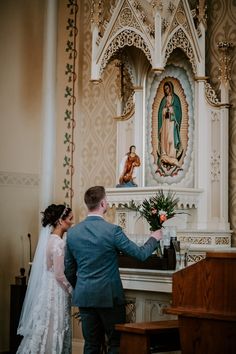 the bride and groom are getting married at the alter