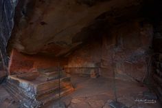 the interior of a cave with steps leading up to it