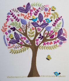 an embroidered tree with birds and leaves on the branches is shown in purple, green, pink