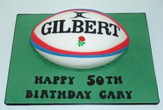 a birthday cake with a rugby ball on it