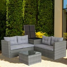 an outdoor patio furniture set with grey cushions