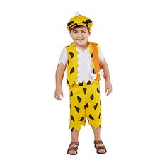 a little boy dressed in a giraffe costume