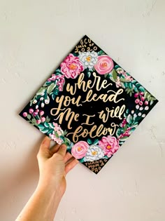 a hand holding up a graduation cap with the words, where you lead me to fellow