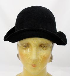 Lovely & rare antique vintage cloche hat of black wool felt, with an upturned brim and original celluloid hat pin ornament. Perfect for a flapper outfit, a Downton Abbey affair, or a Miss Fishers Mysteries Look-alike!It has the label " Hats by Austelle Des Modes e Paris. Its a small size though, 21 3/4" circumference. In excellent condition. Wool Vintage Brimmed Cloche Hat, Vintage Wool Brimmed Cloche Hat, Vintage Wool Cloche Hat With Short Brim, Vintage Wool Cloche Hat, Vintage Wool Cloche Hat With Curved Brim, Vintage Formal Fur Felt Hat, Vintage Wool Felt Hat With Short Brim, Vintage Wool Formal Hat, Vintage Formal Fedora Felt Hat