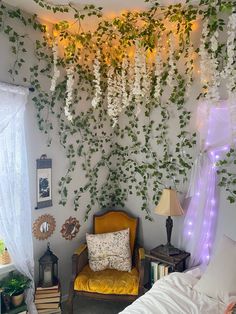 a bed room with a neatly made bed next to a wall covered in vines and flowers