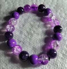 Purple and crystal bead bracelet Round Beaded Crystal Bracelet, Purple Crystal Beaded Bracelets As Gift, Crystal Gemstone Beaded Bracelets, Crystal Stretch Bracelet With Faceted Beads, Adjustable Bracelet With Faceted Beads, Purple Beaded Rosary Bracelet, Purple Crystal Bracelets With Round Beads, Purple Beaded Bracelets With Czech Glass, Purple Czech Glass Bracelets With Colorful Beads