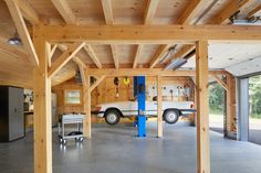 the inside of a garage with wood framing