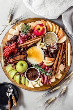 an easy fall charcuterie board with apples, cinnamons, apples and spices