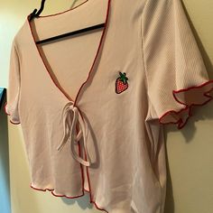 New With Tags. Tie Front Crop Top, Size Medium. Light Pink Color With Strawberry Embroidery. Smoke Free Home. Trendy Embroidered V-neck Tops, Cute Red Tops With Floral Embroidery, Strawberry Embroidery, Front Crop Top, Pink Strawberry, Light Pink Color, Pink Color, Light Pink, Crop Top