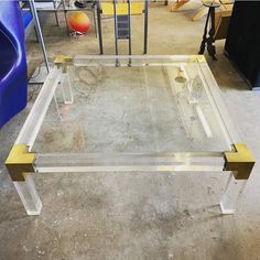 a glass table that is sitting on the ground