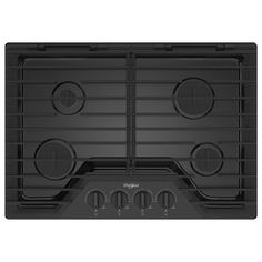 a black stove top with four burners