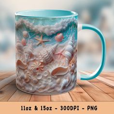 a coffee mug with seashells and starfish on it sitting on a wooden table