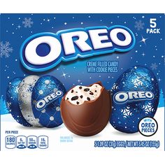 an oreo box with chocolate eggs and snowflakes on the top, in front of a blue background