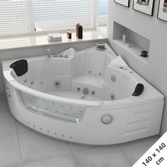 a large white bath tub sitting next to a window