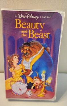 the dvd cover for beauty and the beast from walt's animated movie, disney