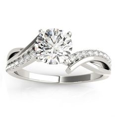 a white gold engagement ring with diamonds on it