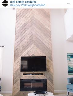 a living room with a television and fireplace