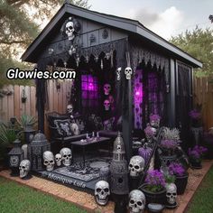 an outdoor halloween decoration with skulls and decorations