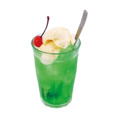 a green drink with ice cream and a cherry on top