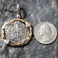 This coin is made from the silver bars recovered from the Atocha. I use moulds from the original coins to get the print. This is a replica but actually made from the silver from the Atocha. The frame around is sterling silver with a 14kt gold overlay and the prongs are sterling silver for an amazing contrast. I use a hammered finish for the frame that gives this piece a beautiful and rich appearance. This is a big, beautiful and statement piece. A true eye-catcher and a stunning piece of history Traditional Round Jewelry For Commemoration, Engraved Coin-shaped Amulet Jewelry, Traditional Gold Jewelry For Commemoration, Traditional Pendant Jewelry For Commemoration, Sterling Silver Coin-shaped Pendant, Brass Coin Shaped Jewelry With Large Pendant, Traditional Sterling Silver Coin Pendant Jewelry, Traditional Sterling Silver Jewelry With Coin Pendant, Collectible Medallion Jewelry With Coin Pendant