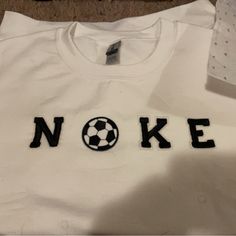 I Only Accepting Paypal Am Selling The "Nike" Hoodies With Things Replacing The I On This One I Did A White Soccer! I Can Do Any Color And Any Size. This Is My First One A White Medium One! I Am Still Very New At These Thank You! White Sporty Hoodie With Team Name, White Sporty Sweatshirt With Letter Embroidery, Sporty White Sweatshirt With Letter Embroidery, White Crew Neck Hoodie With Letter Embroidery, White Embroidered Logo Sweatshirt For Game Day, White Sporty Hoodie With Letter Embroidery, Sporty White Hoodie With Letter Embroidery, White Hoodie With Ribbed Cuffs For Game Day, White Tops With Letter Embroidery For Sports Season