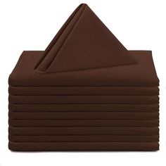 a stack of chocolate colored napkins sitting on top of each other in front of a white background