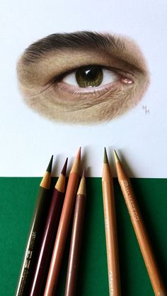 pencils are lined up in front of an eye