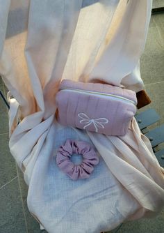 Treat yourself or surprise a loved one with charming small Bow Makeup Bag in a beautiful dusty rose color. This quilted toiletry bag features a delightful embroidered bow detail, adding a touch of elegance to your everyday essentials. Rose Color