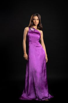 Indulge in sartorial bliss with the purple-coloured Enchanting Alchemist gown. The gown is made with cupro satin and is embellished with hand-crafted beadwork.Details Neckline: One shoulder Material: Cupro satin Lining: Cotton-polyester Made in India What makes this outfit sustainable?This outfit is made with cupro satin; the fabric is made from cotton linter waste. It is a sustainable alternative to polyester. Formal Purple Satin Evening Dress, Silk Floor-length Gown With Satin Finish, Silk Satin Finish Floor-length Gown, Purple Silk Evening Dress, Purple Satin Party Gown, Silk Purple Evening Dress, Purple Satin Gown For Party, Purple Satin Floor-length Gown, Purple Satin Formal Gown