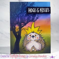 a card with an image of a hedgehog in front of a tree and the words hogs & kisses on it