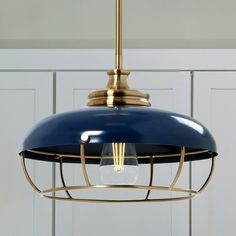 a blue light hanging from a ceiling fixture