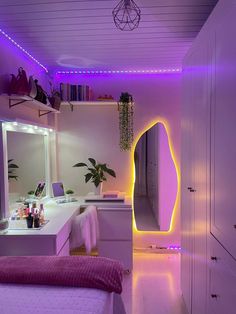 a bedroom with purple lighting in the corner and a mirror on the wall next to it