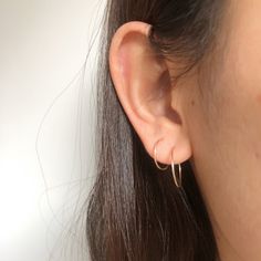 "Simple small dainty hoop earrings, made from from wire. Every single piece is handmade so it might slightly look different from each other. 1 PAIR Thickness: 20 gauge/0.8mm Material & color: 1. Copper plated wire, nickel free 2. Sterling silver, 14k Gold filled and 14k Rose gold filled Choose your options Size 14mm/0.55\" Size 17mm/0.67\" Mixed, 1piece 14mm and 1piece 17mm When putting them on please take your time, give a slight twist and ease through pierce hook into the eye loop and secu Dainty Everyday Threader Earrings, Dainty Hypoallergenic Hoop Earrings, Minimalist Hypoallergenic Circle Hoop Earrings, Minimalist Hypoallergenic Round Hoop Earrings, Gift Single Open Circle Hoop Earring, Minimalist Hypoallergenic Hoop Earrings, Everyday Small Hoop Wrap Earrings For Pierced Ears, Everyday Small Hoop Wrap Earrings, Tiny Minimalist 14k Gold Filled Cartilage Earrings