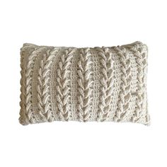 a white knitted pillow on a white background