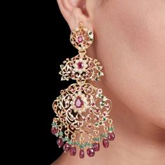 Featuring a pair of intricately handcrafted,oversized yet light weight jadau earrings in 22k gold plated sterling silver. The earrings are embellished with precious freshwater pearls and synthetic colorstones that resemble rubies and emeralds. The hanging beads are excellent color and clarity real rubies and emeralds. The earrings weigh 35 GMs and measure 12 cm x4.75 cm All of Rudradhan's Gold Plated Jewellery is made using 925 Silver, real freshwater pearls and high quality ruby, emerald and sa Jadau Earrings, 22k Gold Jewelry Necklaces, Chand Bali, Sapphire Beads, Gold Plated Jewellery, 22k Gold Jewelry, Hanging Beads, Dangler Earrings, Pearl Necklace Set