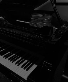 a black and white photo of a piano