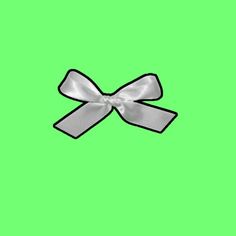 a white bow on a green background