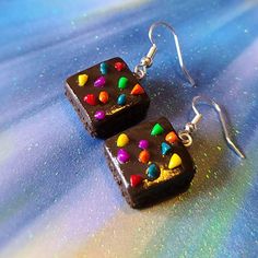 Cosmic Brownie Earrings Brownies measure approximately between 1.5cm to 2.25cm Materials: ▫ Polymer Clay ▫ Hypoallergenic Hanging Earring Hook Each Brownie is handmade by me, so you may receive a pair of earrings that are slightly different from the ones pictured in the listing. As they are all made by hand all are similar but no two pairs will ever be the same! I can also do custom orders. Please feel free to send me a message with any questions or ideas! Thanks for checking out my shop! Cosmic Brownies, Pumpkin Earrings, Hanging Earrings, Small Business Ideas, Wedding Earrings, Polymer Clay Earrings, One Pic, Clay Earrings, Polymer Clay