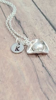 "This listing is for a hand stamped initial necklace featuring a 3/5\" x 1/2\" silver plated pewter tricorne hat charm & 3/10\" stainless steel initial pendant. The silver plated chain is 18\" long, but can be made to your desired length- see last photo in listing. Please indicate the chain length you would like in the 'notes to seller' section at checkout. All items are lead & nickel free. Message me with any questions, thank you! Add an initial to any necklace https://www.etsy.com/list Tricorn Hat, Iolite Necklace, Military Jewelry, Hat Jewelry, Aquamarine Jewelry, Birthstone Pendant, Aquamarine Stone, Agate Necklace, Initial Pendant