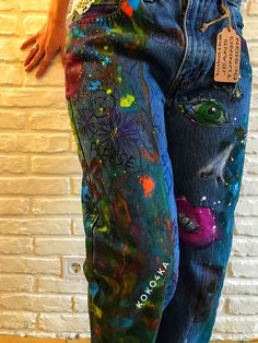 the jeans are painted with different colors and designs