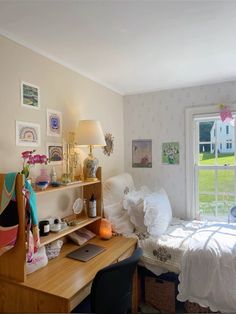 a bedroom with a bed, desk and window in it's centerpieces