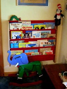 a child's room with an elephant book shelf