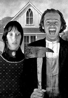 two people standing next to each other in front of a house holding a large hammer