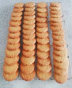 several rows of cookies are lined up on a rack