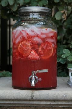 a jar filled with liquid sitting on top of a table