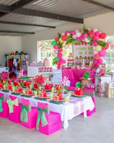 a table topped with lots of cakes and desserts